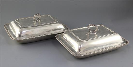 A pair of George IV Irish silver entree dishes and covers, by James Le Bas, 126 oz.